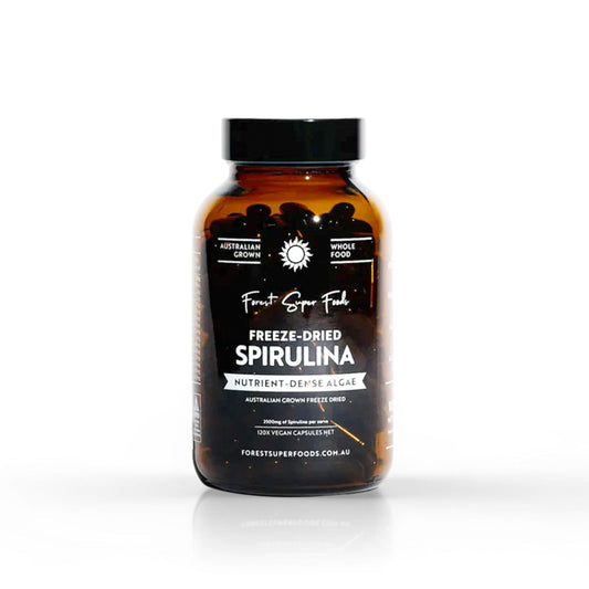 Freeze-dried spirulina supplement bottle, amber glass with black cap and label.