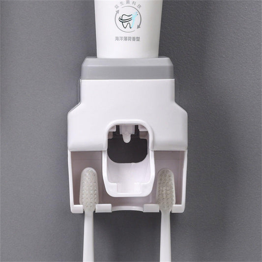 Wall-mounted toothpaste dispenser with toothbrush holder, white and grey