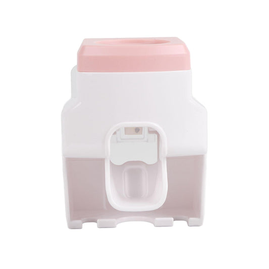 Wall-mounted toothpaste dispenser squeezer with toothbrush holder, pink top and white body
