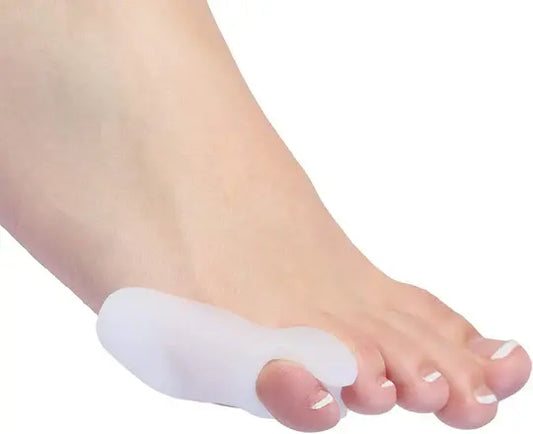 White toe spacer sleeve separating toes on side view of foot.