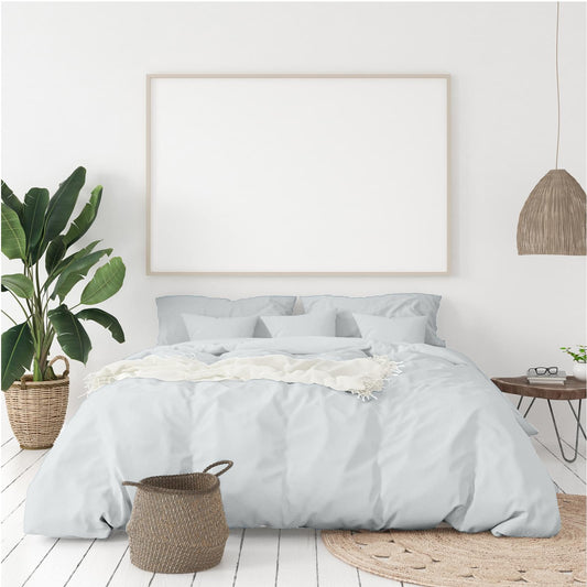 Cool grey quilt cover and pillowcases set, neatly arranged on bed