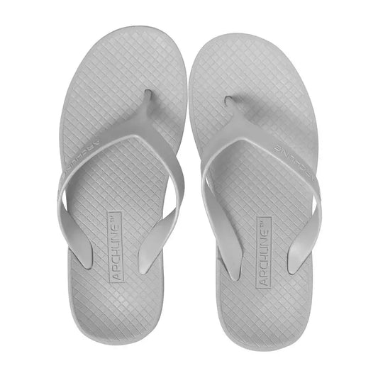 White Archline orthotic thong flip-flops with textured footbed and T-strap
