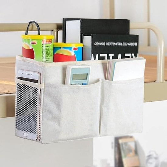 White bedside organizer basket with side mesh pocket and two top handles