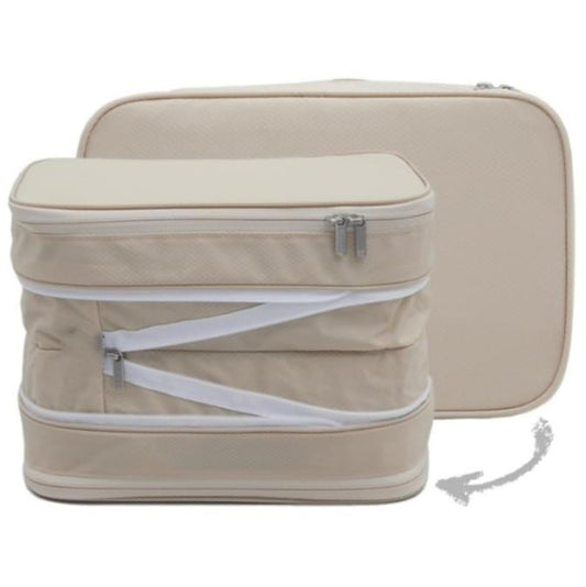 Beige double-zip expandable clothing storage bag, rounded shape with front zipper