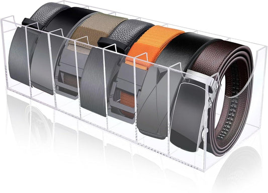 Clear acrylic belt organizer with multiple compartments holding dark and tan belts