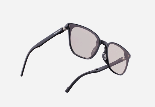 Dark frame sunglasses with mauve-tinted lenses and slim straight temples