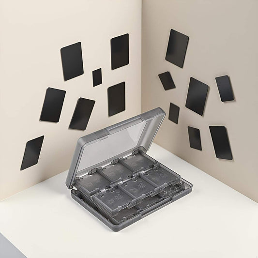 Black game holder case open on surface with multiple cartridge slots inside