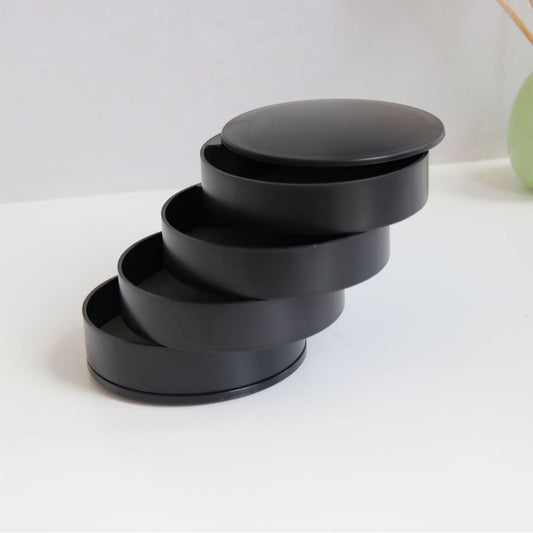 4-layer rotating jewelry storage box with dark lid and stacked compartments