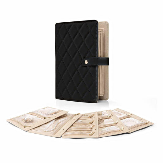 Quilted black jewelry organizer binder with clasp strap and open pages
