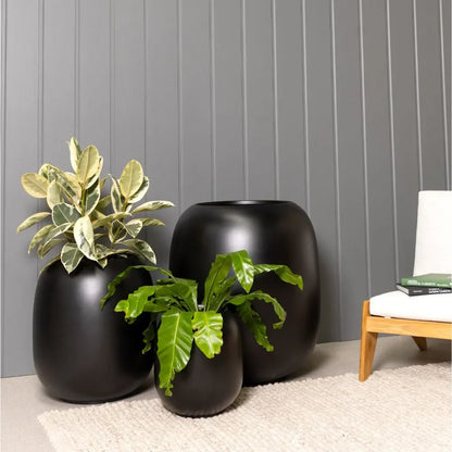 Matte dark ceramic vase set of three with open tops and planter-style bases