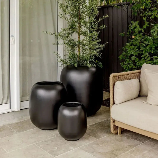 Matte charcoal ceramic vase set of three, rounded silhouettes with open tops