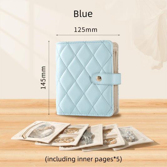 Light blue quilted jewelry storage book with clasp strap and rounded corners.