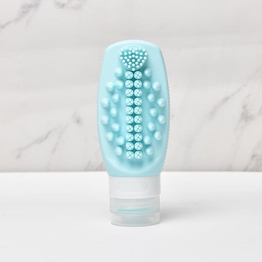 Light blue silicone refill brush bottle, pointed comb teeth, white squeeze cap
