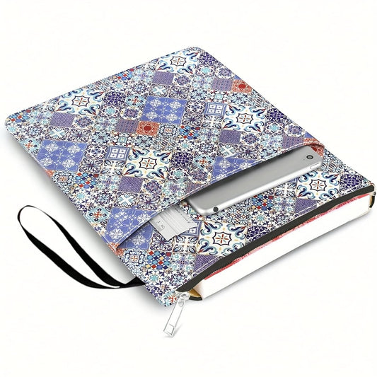 Blue and purple patterned book sleeve with zipper and carry strap, laid open flat.