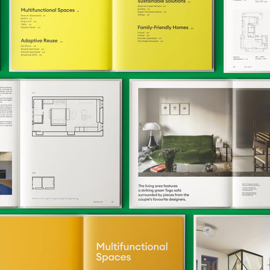 Open interior design book spread with floorplan diagrams and living room photos