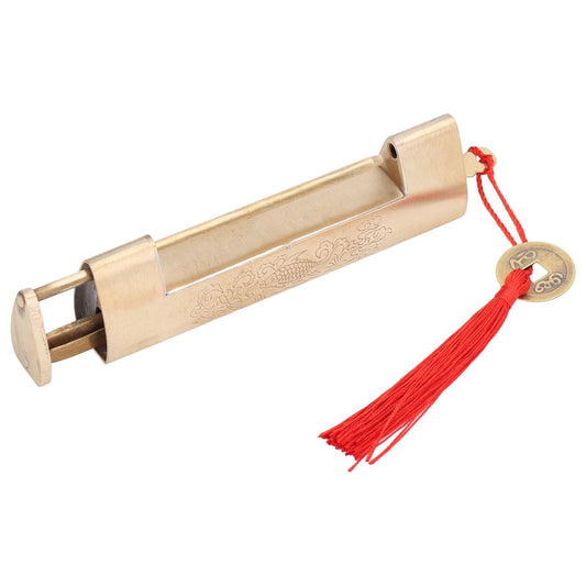 Brass antique padlock with engraved bar and open shackle, red tassel with key charm