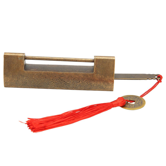 Antique brass horizontal padlock with red tassel cord and round coin charm