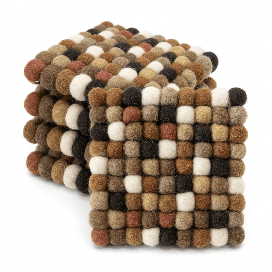 Round wool felt coaster with thick checker-like pom-pom surface in earth tones