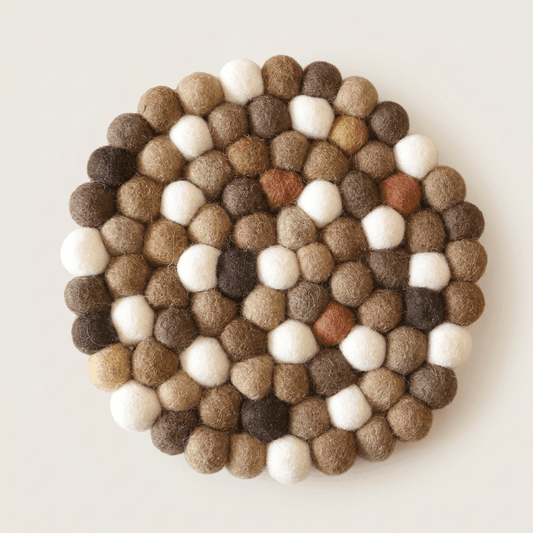 Round wool felt trivet with multicolor white and brown needle-felted balls