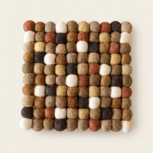 Square wool felt trivet with multicolor white, brown, and rust ball pattern