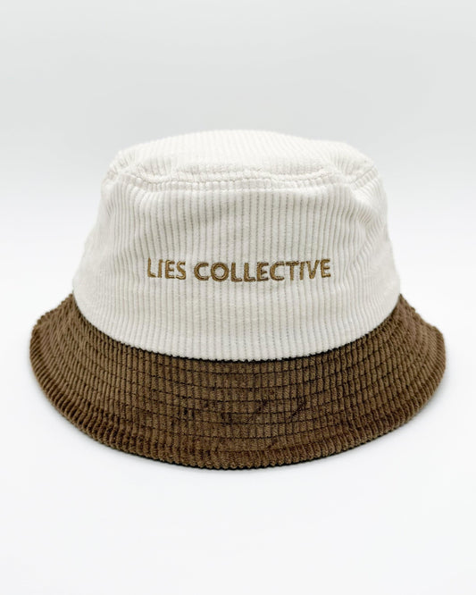 Two-tone bucket hat with white crown and brown brim, featuring 'LIES COLLECTIVE' print
