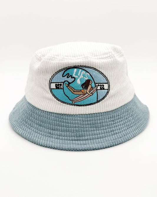Light blue and white bucket hat with ocean graphic front patch