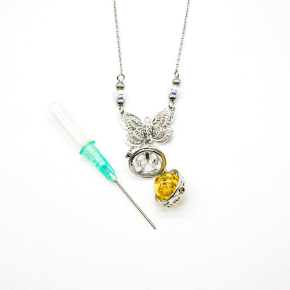 Silver-tone butterfly locket necklace with vial dropper and multicolor accent beads