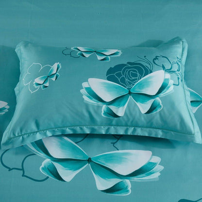 Turquoise quilt cover with large butterfly and floral motifs, piped edges