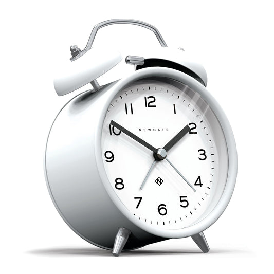 White twin-bell alarm clock in side view, matte pebble finish, black hands, hour markers