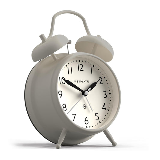 Grey alarm clock with twin bells and raised dial, shown in close angled view