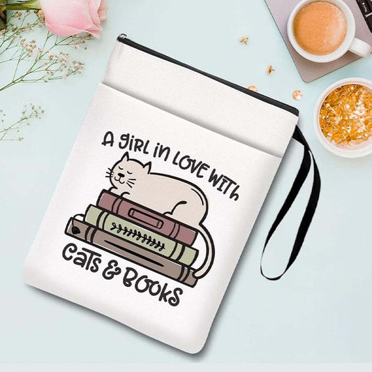 White book sleeve with zipper and cat-themed printed design, with carry wrist strap.