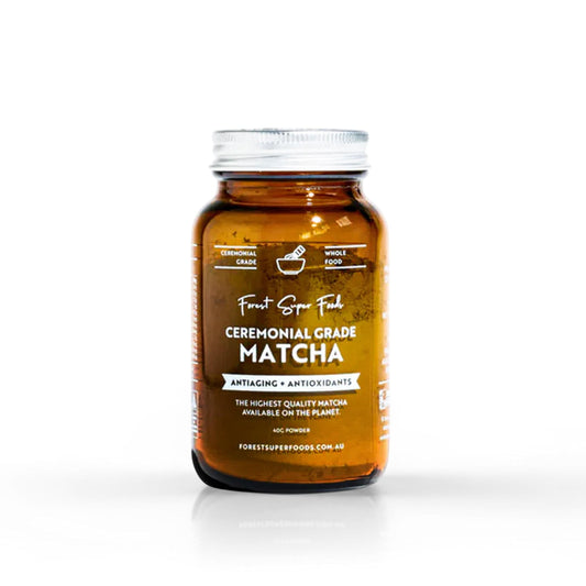 Ceremonial grade matcha jar, amber glass container with white screw lid and front label