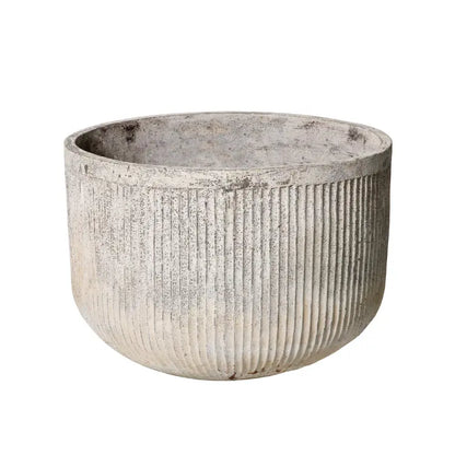 Chardonnay round concrete planter pot with vertical ribbed texture, light beige