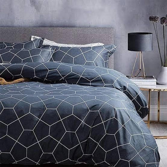 Navy duvet cover with light blue hexagon grid pattern and coordinated pillowcase