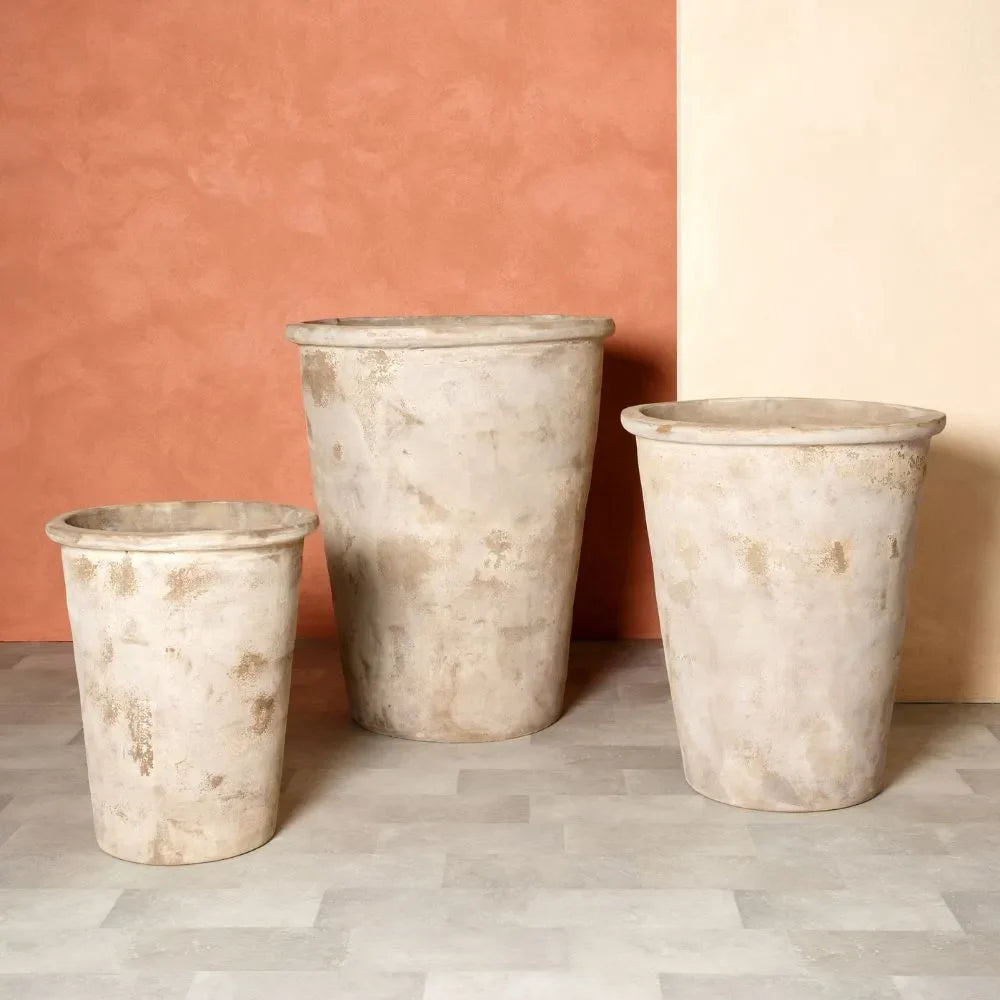 Three conical planter pots with light speckled finish, varying heights