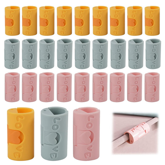 Clothes peg clips set in yellow, blue, and pink cylinders with curved slots