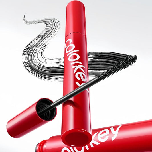 Red mascara tube and black wand sweeping bold dark black curl lines