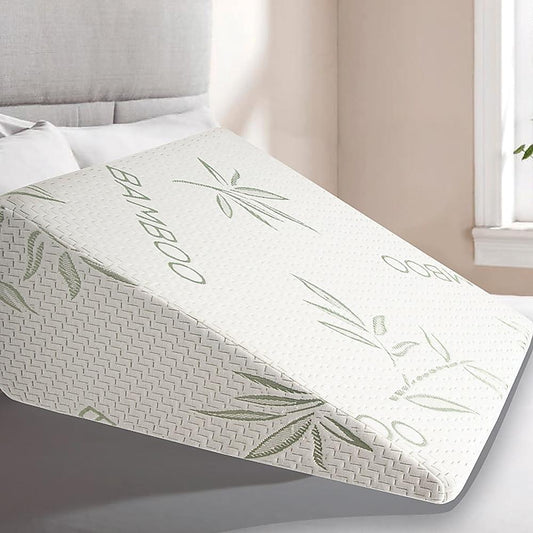 White wedge support pillow with green leaf pattern, designed for neck and back