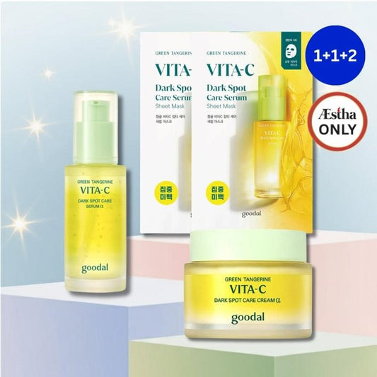 Vita-C dark spot care set with cream jar, serum bottle, and sheet mask boxes