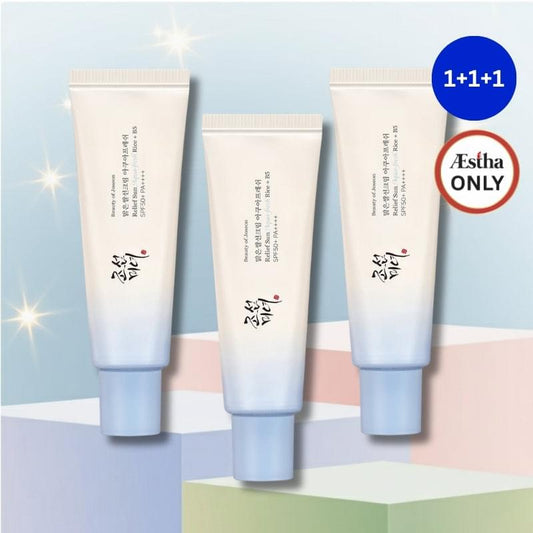Set of three SPF sunscreen tubes in cream with light blue bases