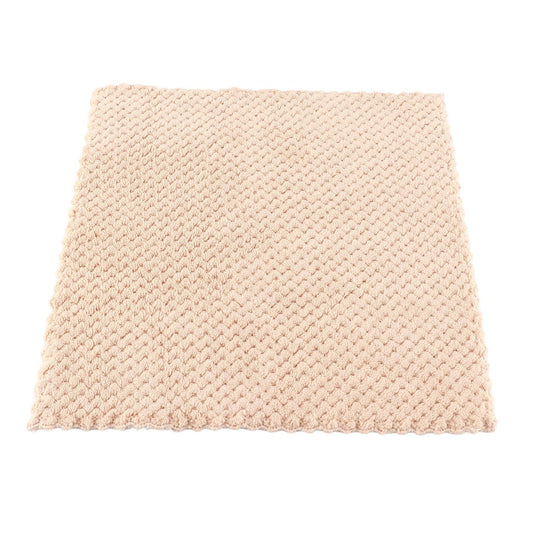 Beige waffle bath towel, folded square with textured surface and stitched edges