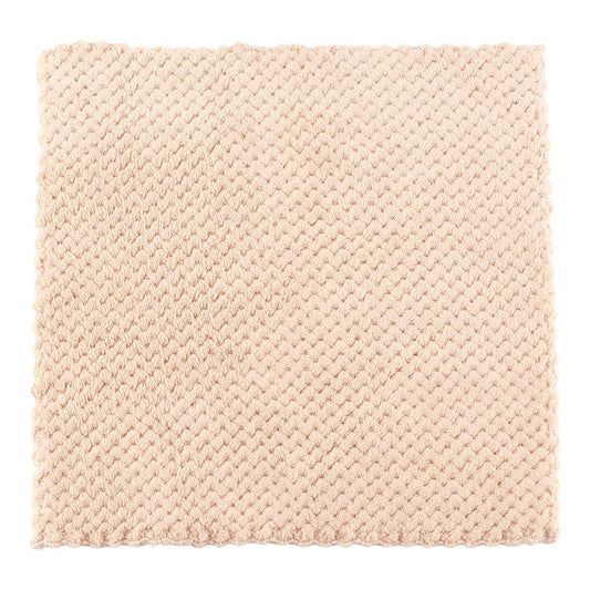 Beige waffle bath towel, neatly folded with textured weave and visible hem trim