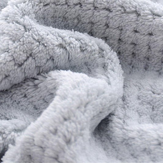 Gray bath towel with plush looped pile, close-up texture view