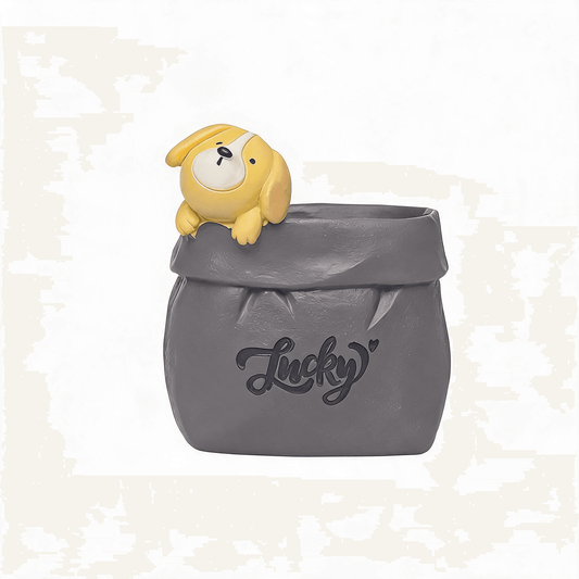 Grey resin dog pen holder with cartoon pup on top and Lucky script