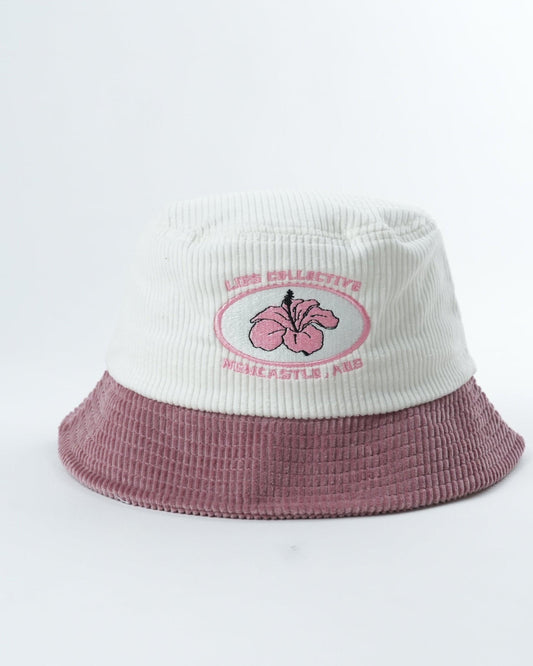 Kids bucket hat, white top and mauve brim with flower patch logo