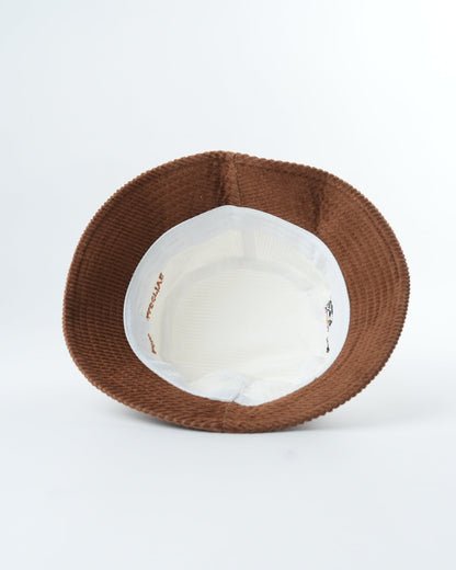 WOMBAT Wrangler bucket hat, brown woven exterior with light fabric inner lining