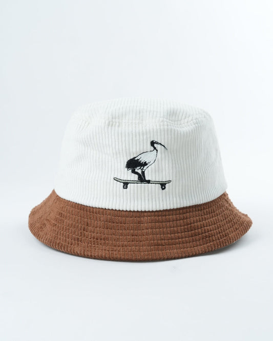 White knit bucket hat with brown brim and black skateboard graphic