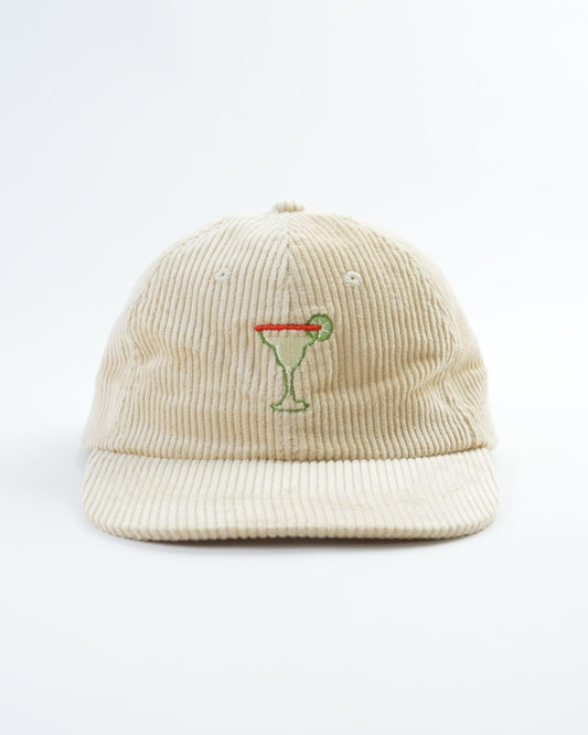 Cream corduroy beanie-style hat with embroidered margarita cocktail logo