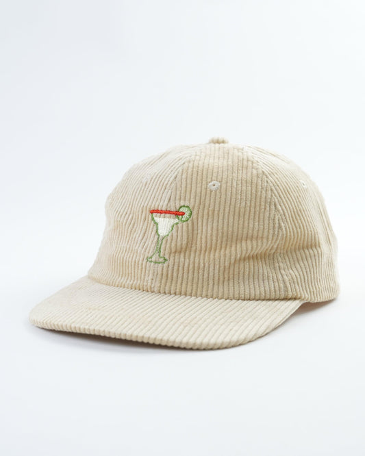 Cream corduroy hat with embroidered margarita cocktail logo and curved brim