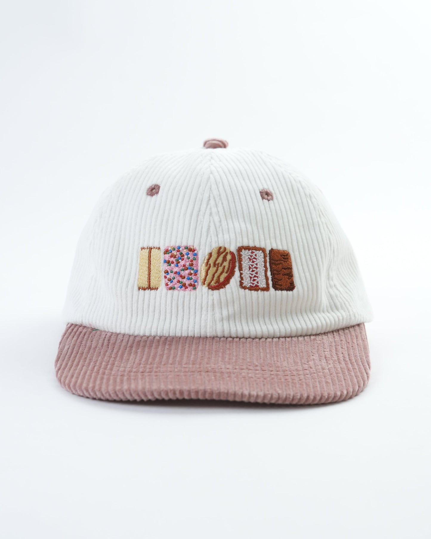 Knit cap with ribbed crown, colorful 'AUSSIE' logo patch, mauve brim